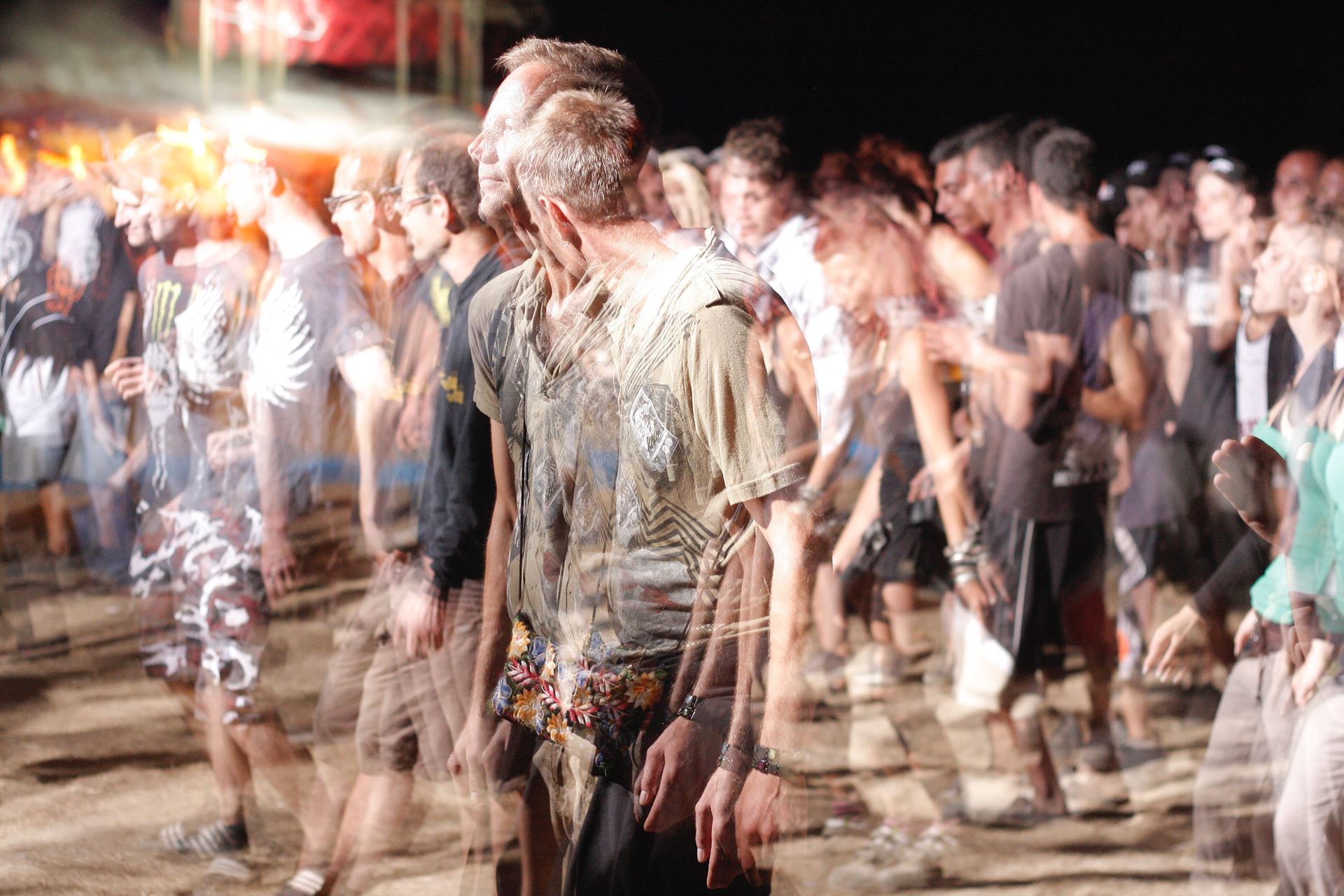 a group of people standing in front of a crowd