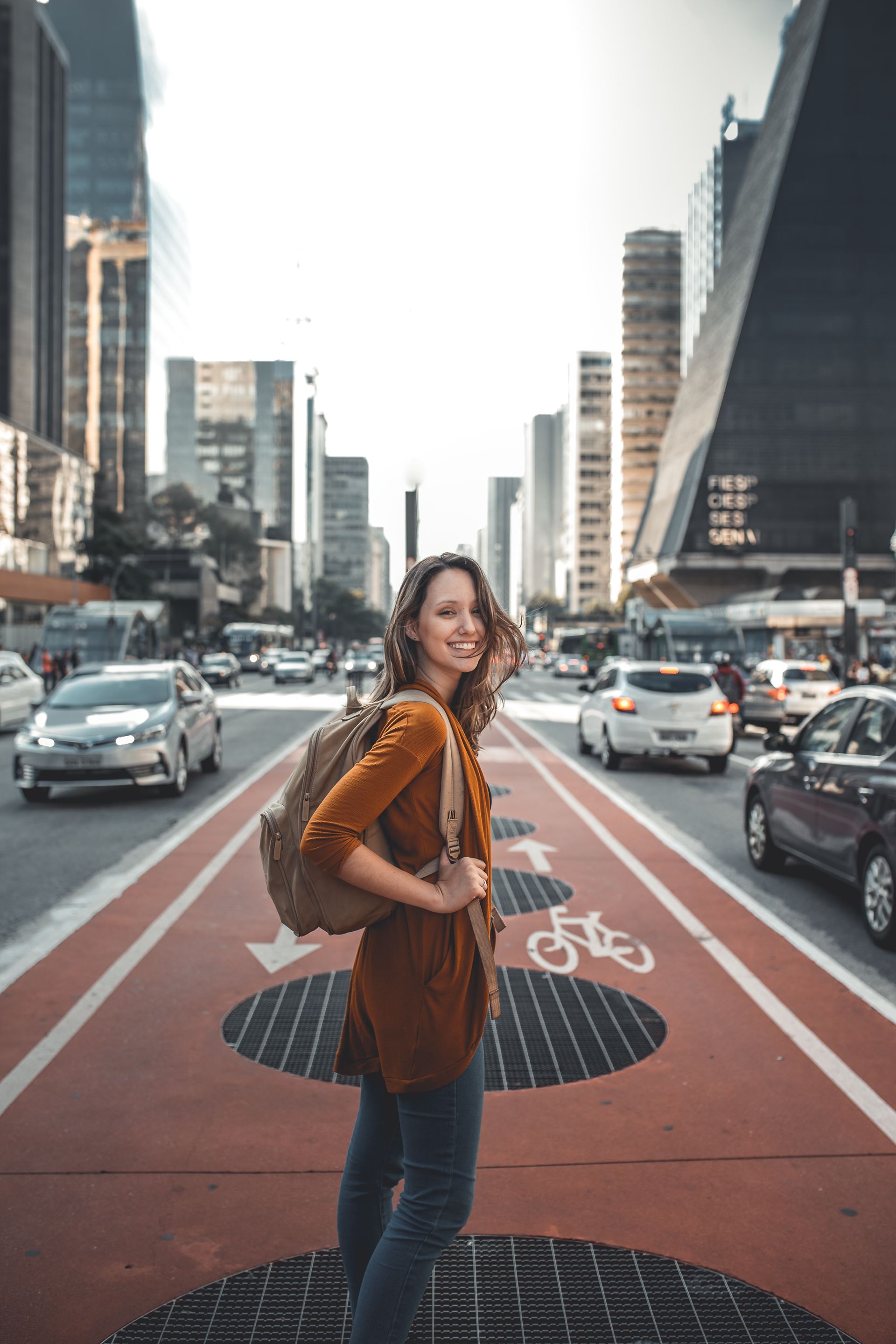 a woman walking down a city street